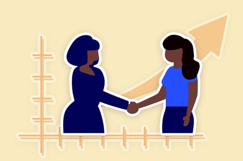 Two women shaking hands