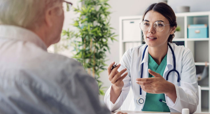 Physician talking with an elderly patient