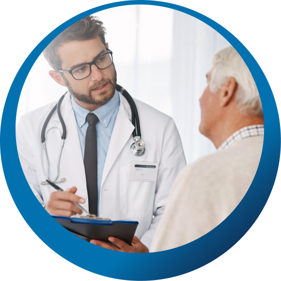 A urologist in consultation with an older male patient.